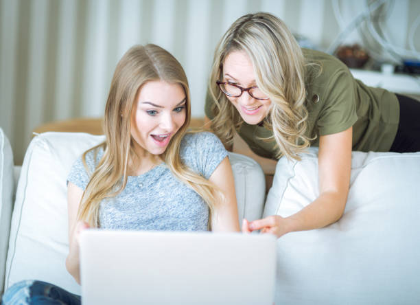 istock Beautiful young womans working with laptop 671494546