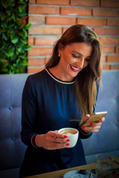 istock Cute girl drinking coffee in coffee house 671500528