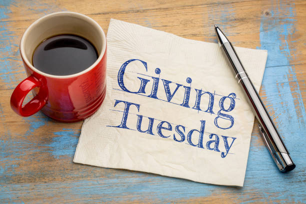 Giving Tuesday concept on napkin Giving Tuesday  - handwriting on a napkin with a cup of espresso coffee giving tuesday stock pictures, royalty-free photos & images