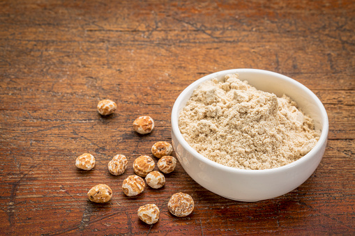 organic tiger nuts, a rich source of resistant starch - peeled nuts and powder for smoothies