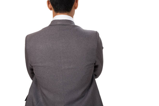 istock Thoughtful businessman standing back to camera with arms crossed on white background 671504472