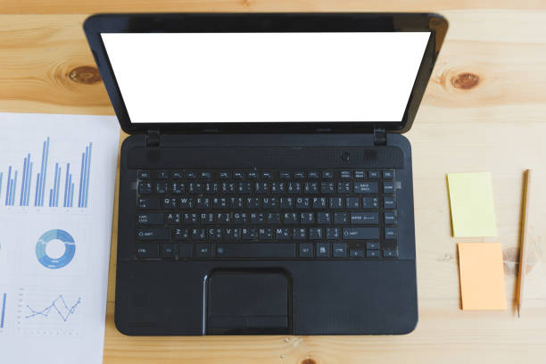 istock Business workplace with laptop computer, sticky note and paper with graphs and diagrams 671504580