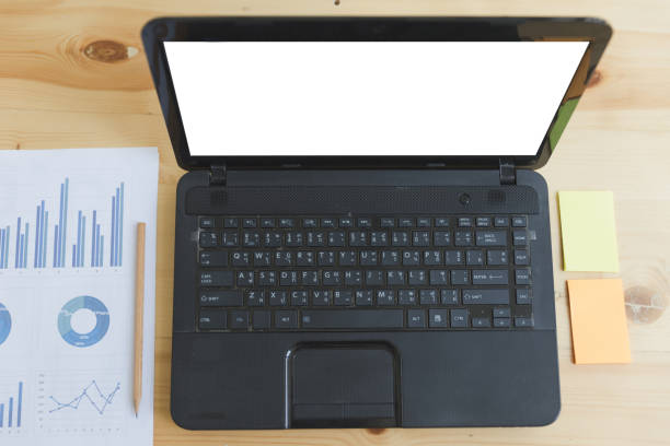 istock Business workplace with laptop computer, sticky note and paper with graphs and diagrams 671504626