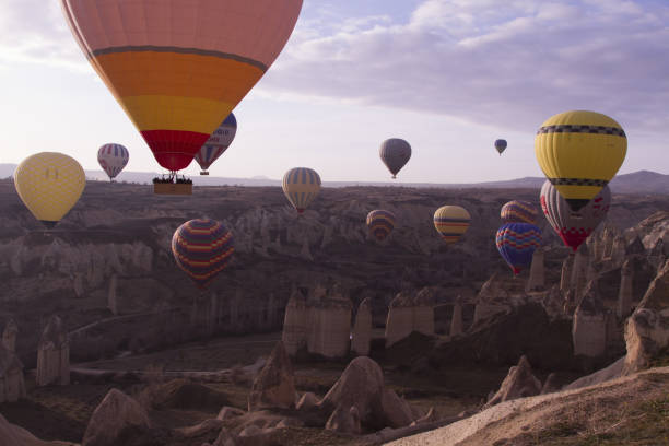 istock Strange stone formations, Cappadocia, Turkey. People during journey to Cappadocia 671514654