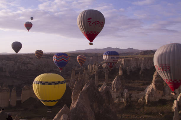 istock Strange stone formations, Cappadocia, Turkey. People during journey to Cappadocia 671514876