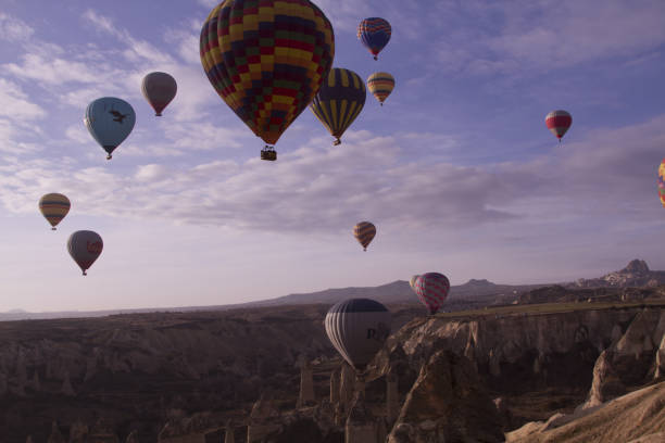 istock Strange stone formations, Cappadocia, Turkey. People during journey to Cappadocia 671524004