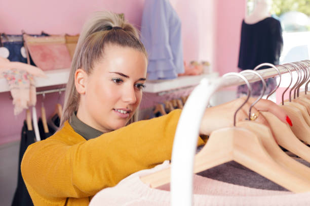 istock Clothing store owner checking everything its okay. 671527160