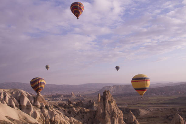 istock Strange stone formations, Cappadocia, Turkey. People during journey to Cappadocia 671527590