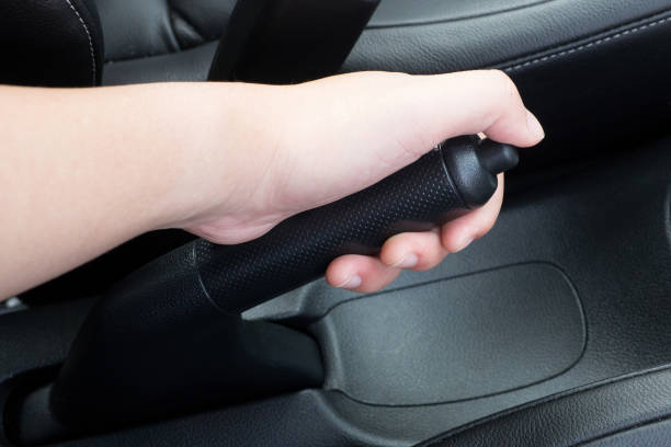 istock Hand brake pull in the car transport safety black interior 671530182