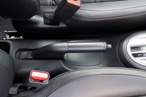 istock Hand brake pull in the car transport safety black interior 671530198