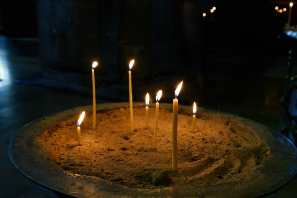 istock Lighting candles in Orthodox Svetitskhoveli. Mtskheta, Georgia 671533642