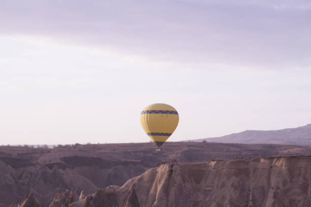 istock Strange stone formations, Cappadocia, Turkey. People during journey to Cappadocia 671534454