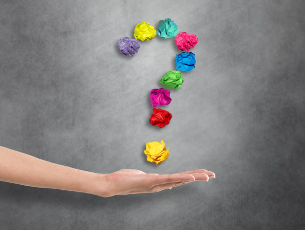 istock Hand holding crumpled question mark symbol 671536482
