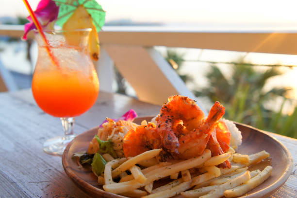 istock Fried chips with shrimps and juicy fruit in resort 671543216