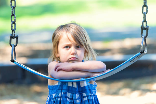Sad caucasian autistic little girl