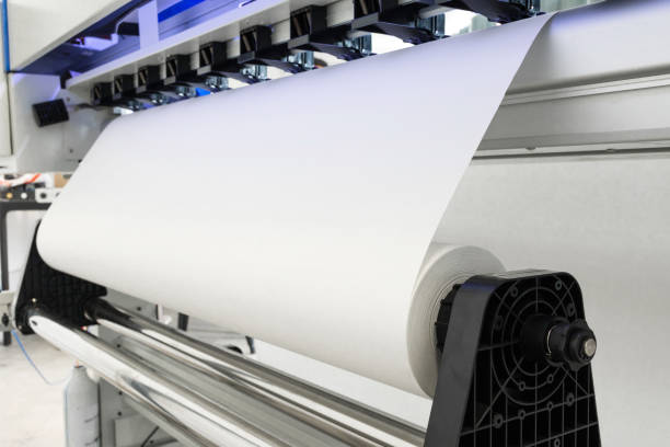 istock Paper roll in large printer format inkjet machine for industrial business. 671551462