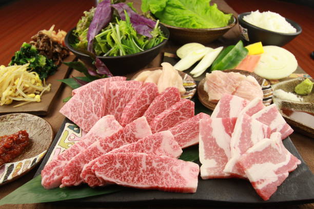 istock Fresh sliced beef with vegetables on tables in the kitchen 671554338