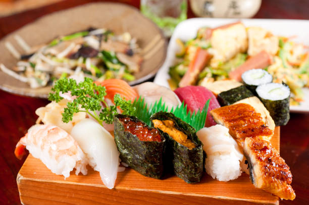istock Delicious sushi with shrimp tuna, squiz and rice 671560350