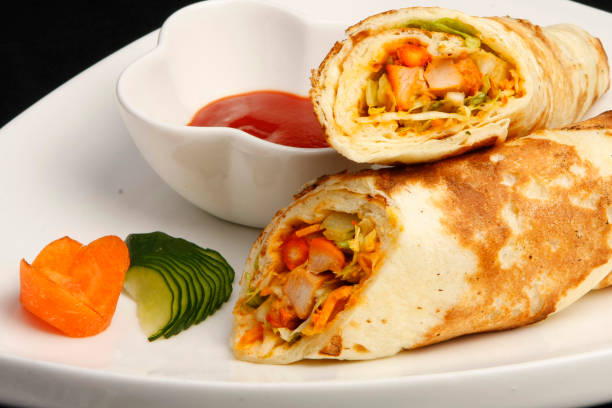 istock Mexican tacos with chili sauce on white dish 671561274