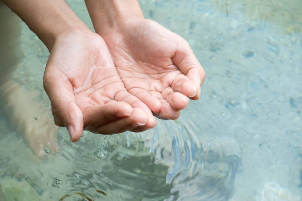 istock Clear natural water in woman hands. 671568658