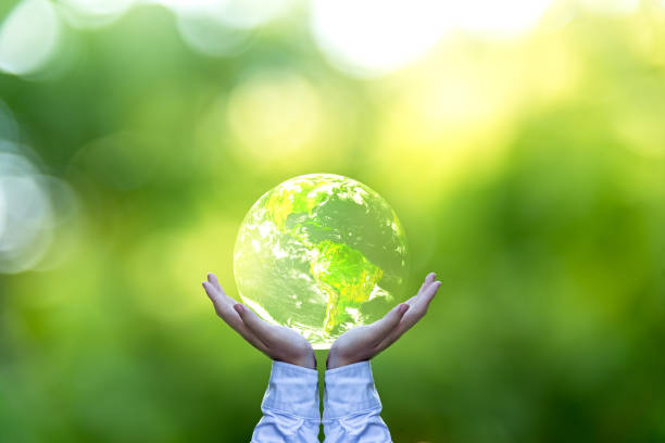 istock Holding a glowing earth globe in his hands. Earth image provided by Nasa. 671571414