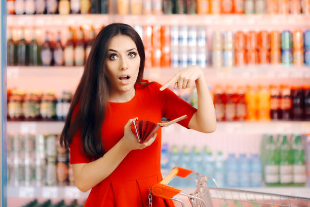 istock Funny Customer Checking Her Wallet in a Department Store 671571524