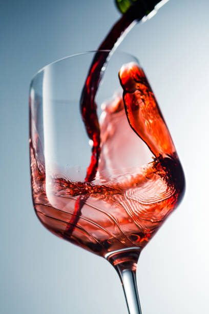 Red wine pouring in glass