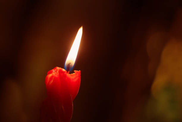 istock Candle at night closeup 671578738