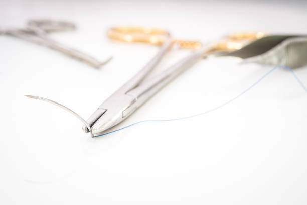 istock Close up of needle holder with suture and needle 671578814