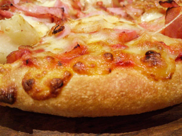 istock Closeup to Yummy Hawaiian Pizza Background/ Texture 671579930