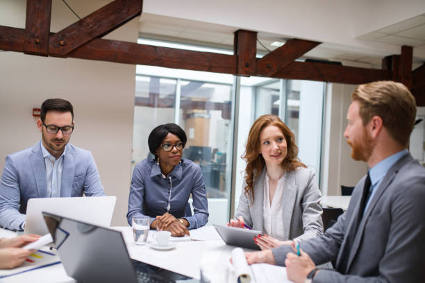 istock Business partners discussing documents and ideas at meeting 671597778