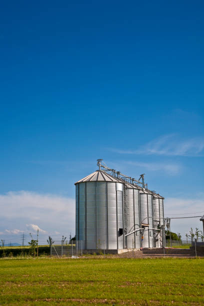 istock beautiful silver silos in landscape 671601356