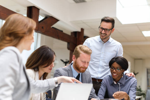 istock Business people using mobile phone during business meeting 671605102