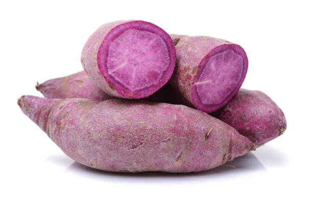 purple sweet potato  on white background - sweet potato imagens e fotografias de stock