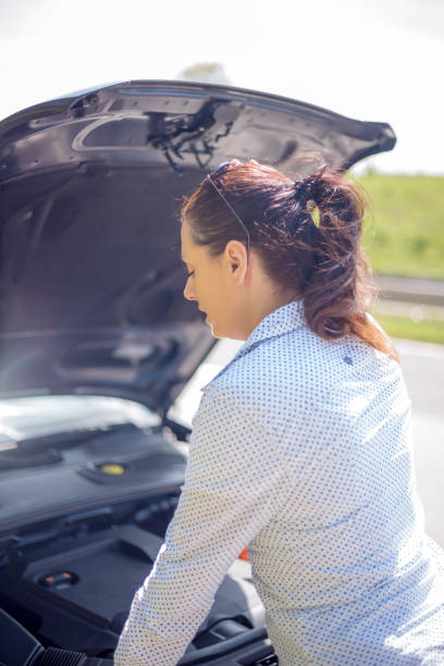 istock Woman and her broken off-road vehicle 671615016