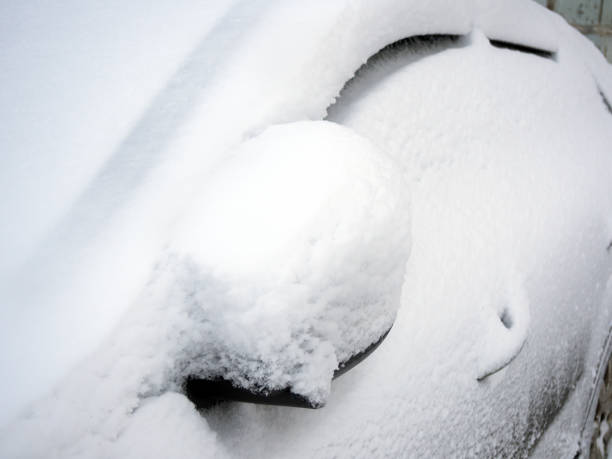 istock Car covered with snow after a hurricane 671625944