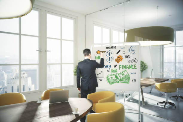 istock Man drawing financial sketch 671629594