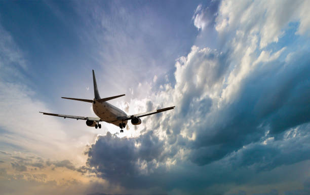 istock Airplane in the sky and cloud at sunrise 671634576