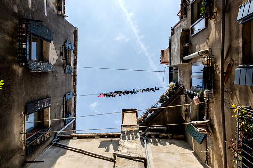 Clothes hang to dry in Venice, view from the bottom up.