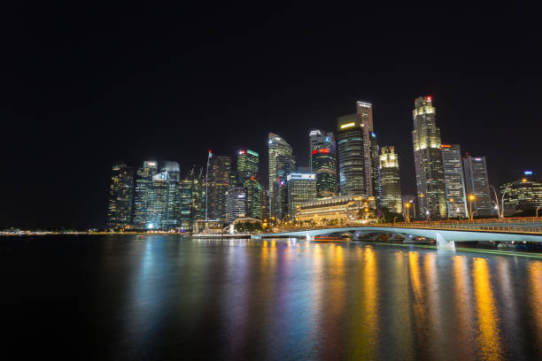 istock Singapore cityscape at night time 671640860