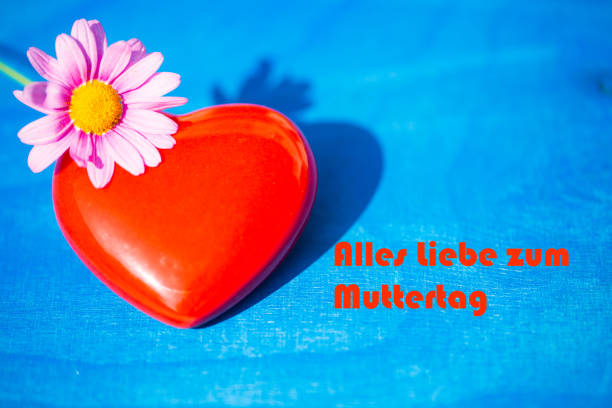 istock red heart on a blue background, mothers day 671641616