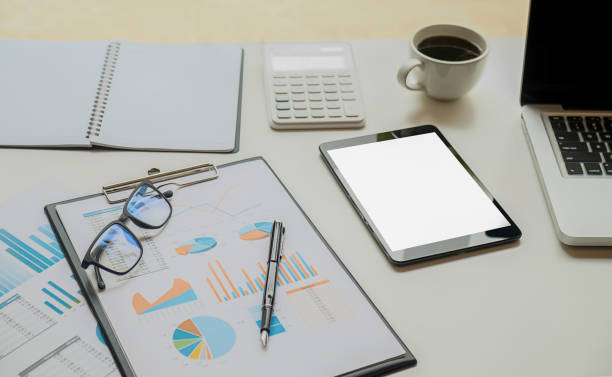 istock Business concept with copy space. Office desk table with pen focus and analysis chart, computer, notebook on desk.Vintage tone Retro filter. 671644610