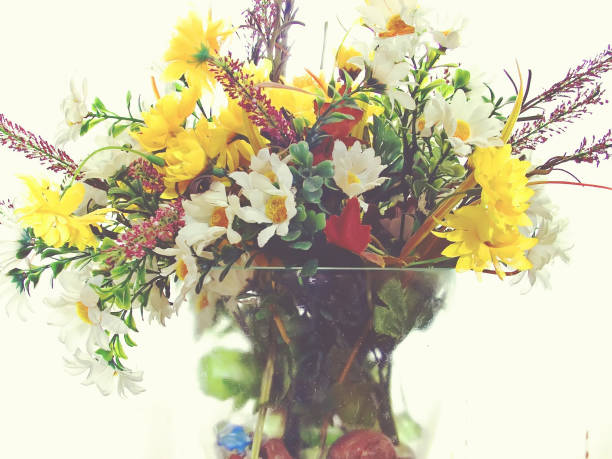 istock Bouquet of artificial flowers in a glass vase 671649310