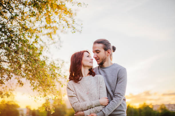 istock Romantic couple in the park 671656928