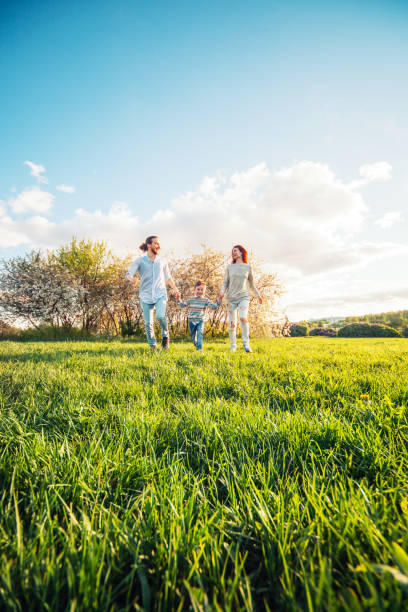 Happy family running in the park