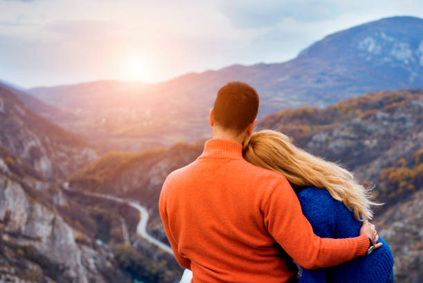 istock Young couple enjoying picnic in nature 671664680