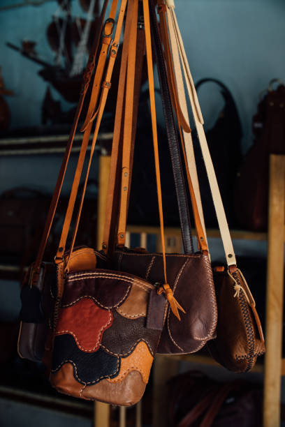 istock Authentic women's leather bags and purses in a handmade shop 671667824