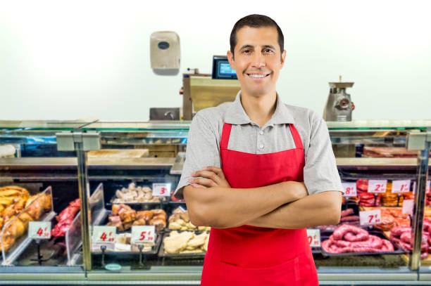 istock butcher standing arms crossed at butchery 671671142