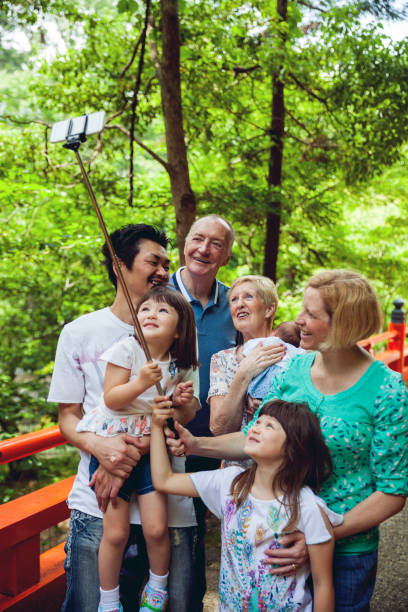 istock Mixed japanese family selfie time 671673998