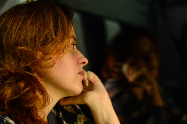 istock Woman talking on the phone in a train 671677850